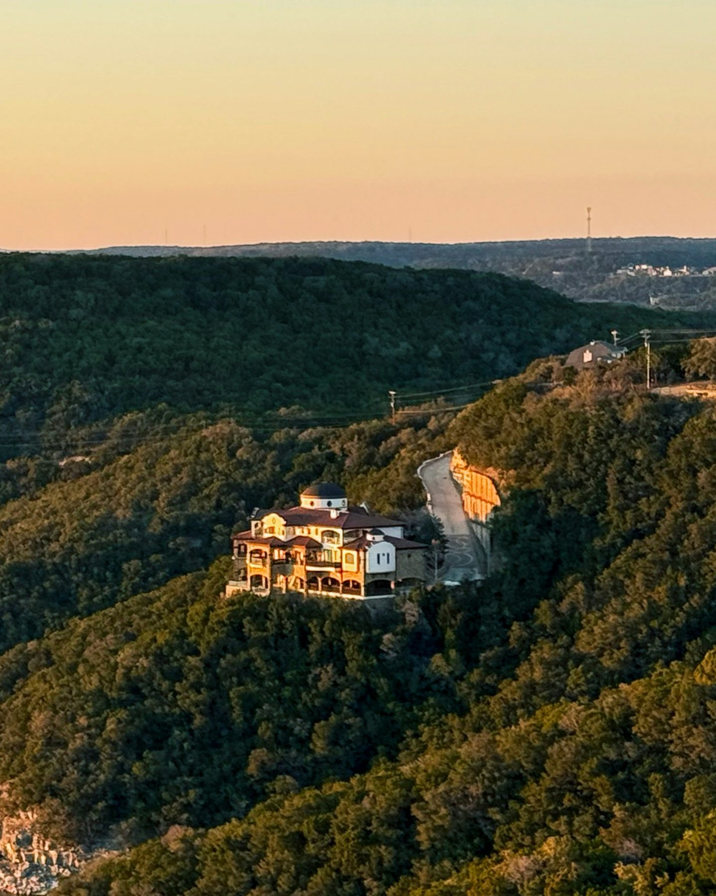 A limestone Austin home in warm evening light